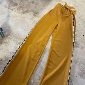 Wide legs pants with side stripes. Mustard color. Tie in the front or side.